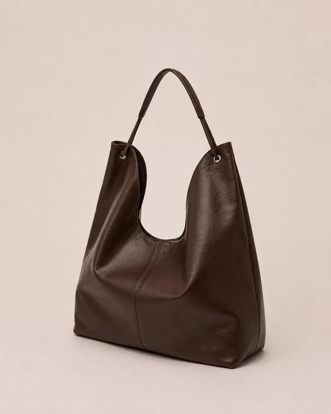 Angled front view of the Colette dark chocolate leather hobo tote bag featuring a soft silhouette, spacious interior and elegant everyday styling.