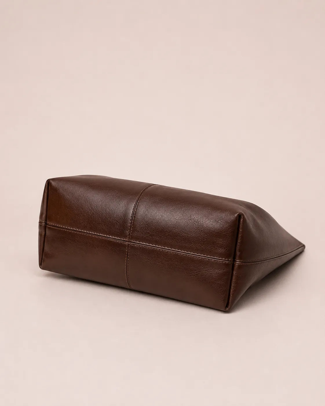 Bottom view of the Colette dark chocolate leather hobo tote bag showing the structured base and premium leather craftsmanship.