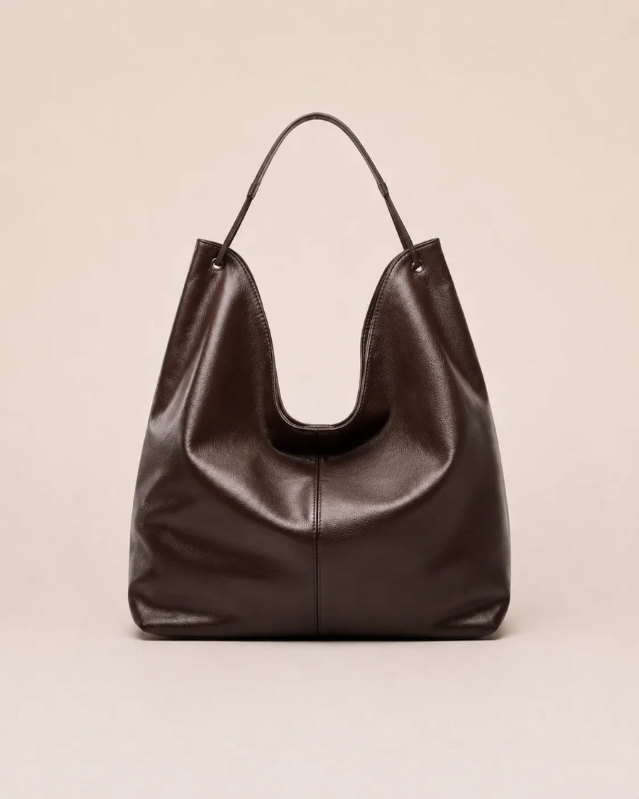 Front view of the Colette dark chocolate leather hobo tote bag crafted from genuine leather with a soft silhouette and spacious everyday design.