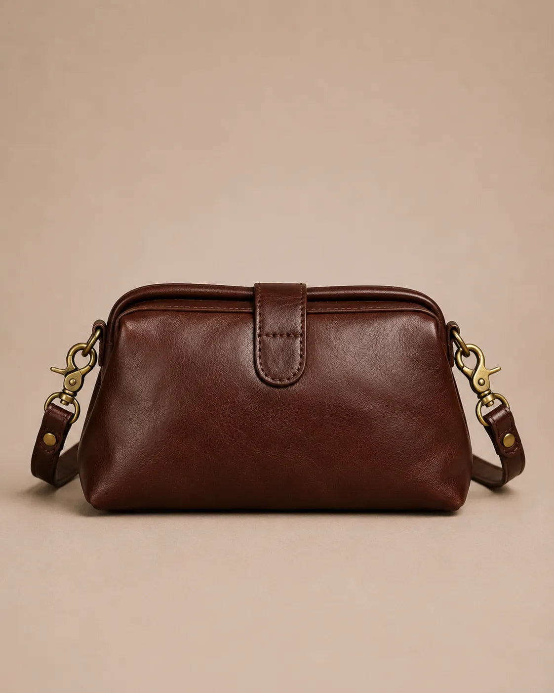 Eloise leather crossbody bag in dark chocolate genuine leather featuring a structured vintage-inspired silhouette, angled back view.