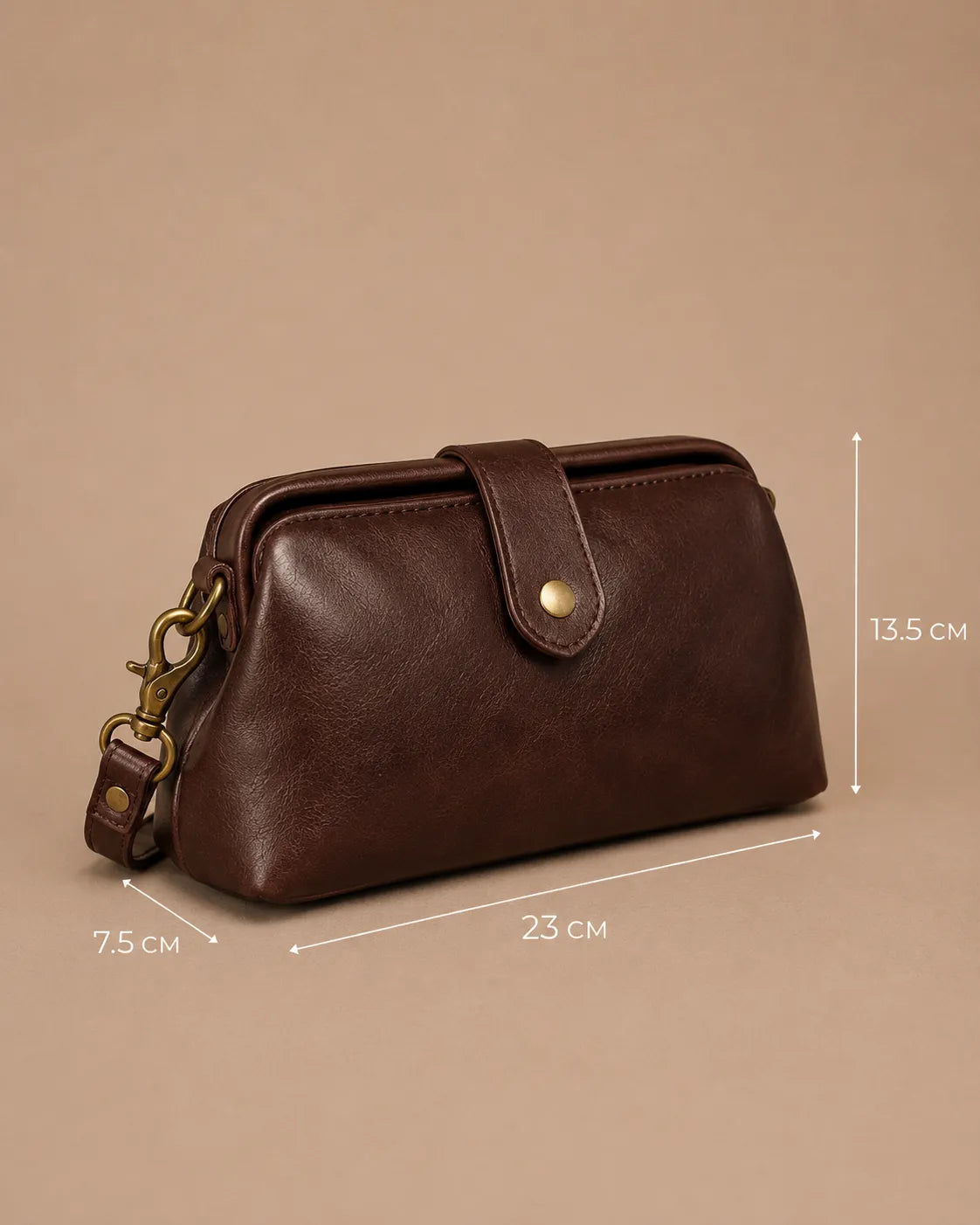 Eloise leather crossbody bag in dark chocolate genuine leather showing dimensions of 23 cm width, 13.5 cm height and 7.5 cm depth.