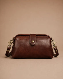 Front view of the Eloise leather crossbody bag in dark chocolate genuine leather with vintage-inspired brass hardware.