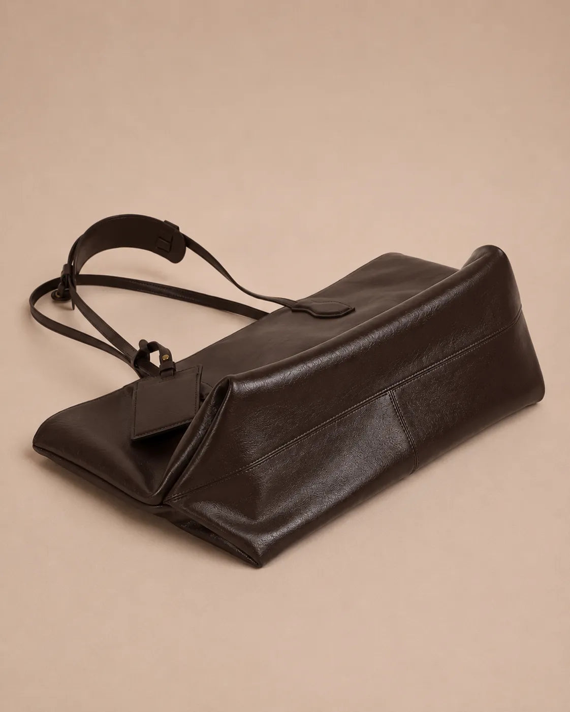 Bottom view of the Emilia Tote in dark chocolate leather, highlighting the structured base and soft leather construction.