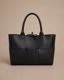 Front view of the Florence woven leather tote bag in black genuine leather.