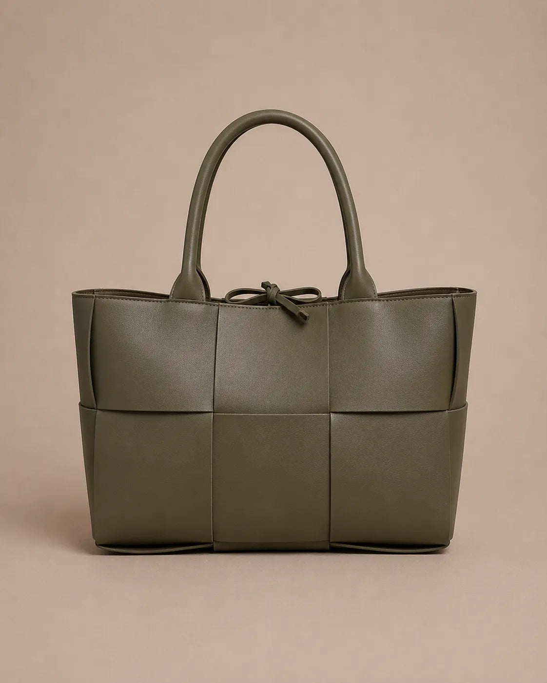 Front view of the Florence woven leather tote bag in forest green genuine leather.