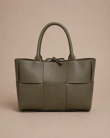 Front view of the Florence woven leather tote bag in forest green genuine leather.