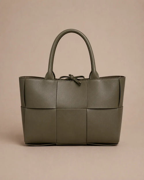 Front view of the Florence woven leather tote bag in forest green genuine leather.