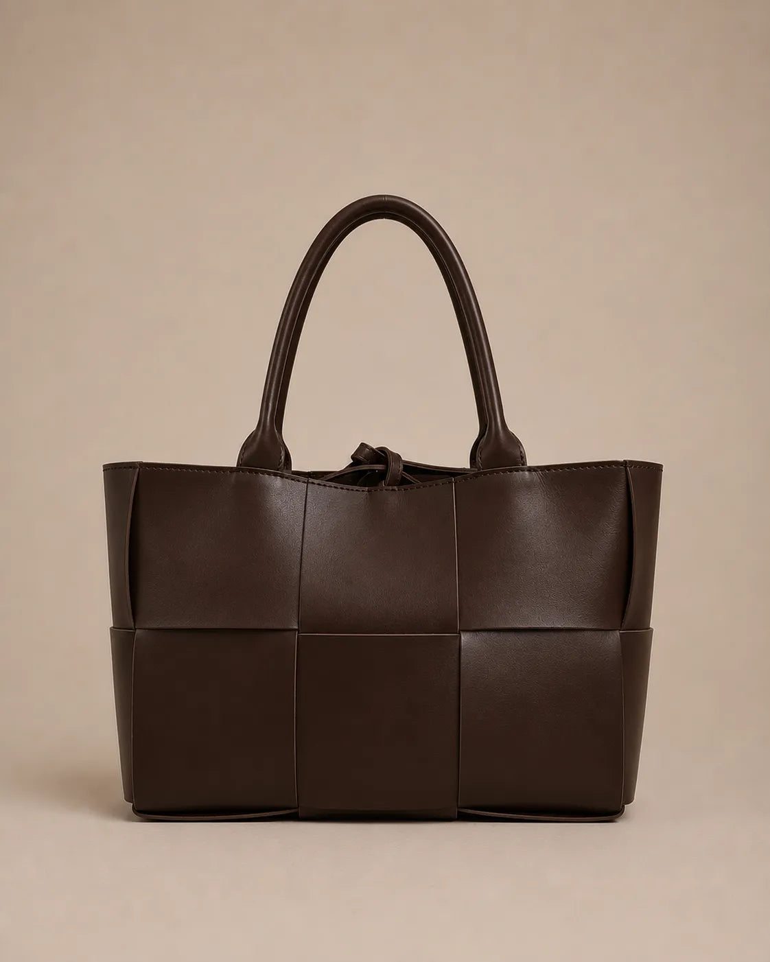 Front view of the Florence woven leather tote bag crafted from genuine chocolate brown leather.