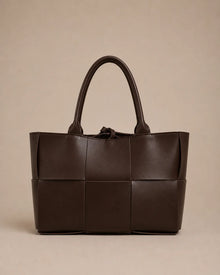 Front view of the Florence woven leather tote bag crafted from genuine chocolate brown leather.