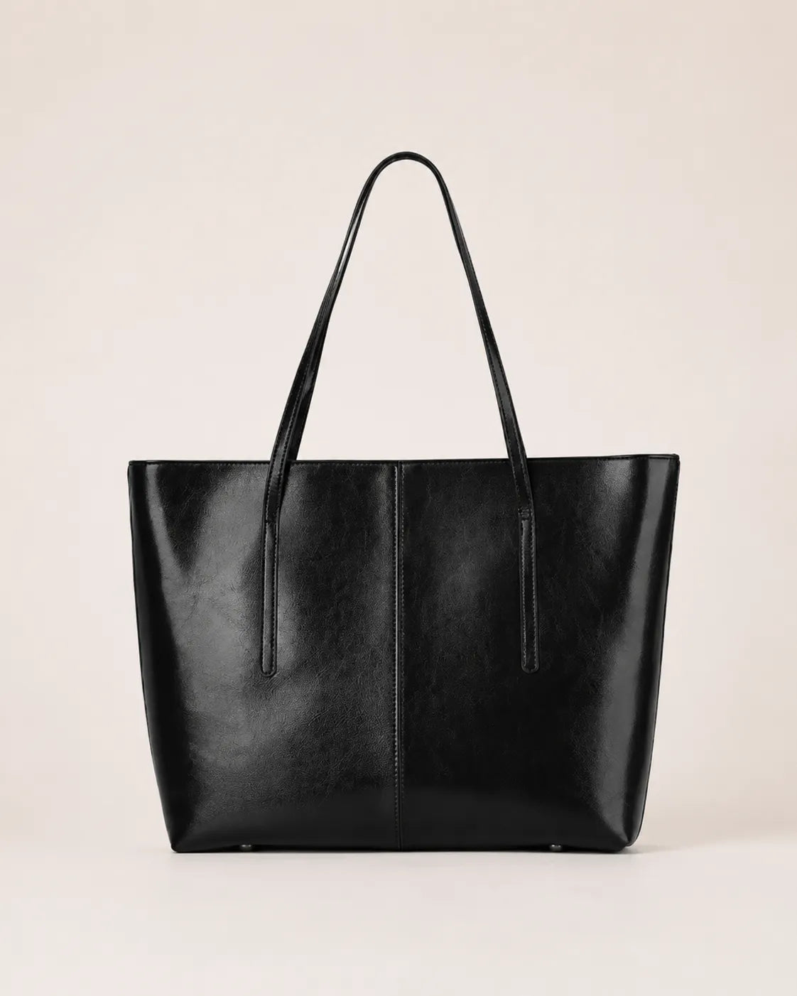Margaux large black leather tote bag front view with double shoulder straps and spacious structured silhouette