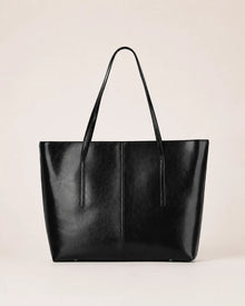 Margaux large black leather tote bag front view with double shoulder straps and spacious structured silhouette