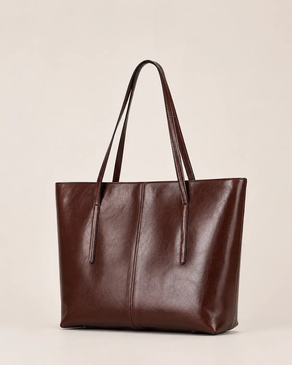 Margaux large dark chocolate leather tote bag shown in a front angled view with double shoulder straps and structured silhouette
