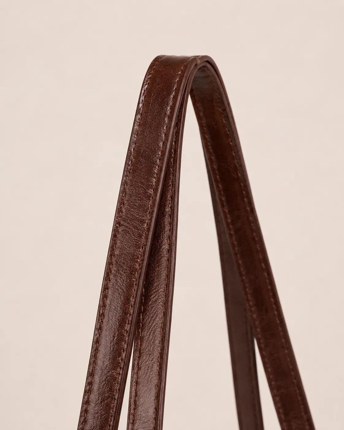 Close up detail of Margaux large leather tote bag shoulder straps showing premium leather craftsmanship