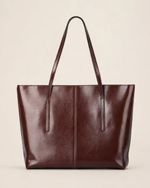 Front profile of the Margaux large dark chocolate leather tote bag crafted from genuine leather with a spacious structured design