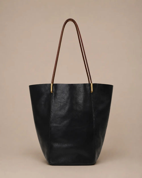 Margot Tote in black genuine leather with a minimalist design, spacious interior and versatile day-to-evening appeal.