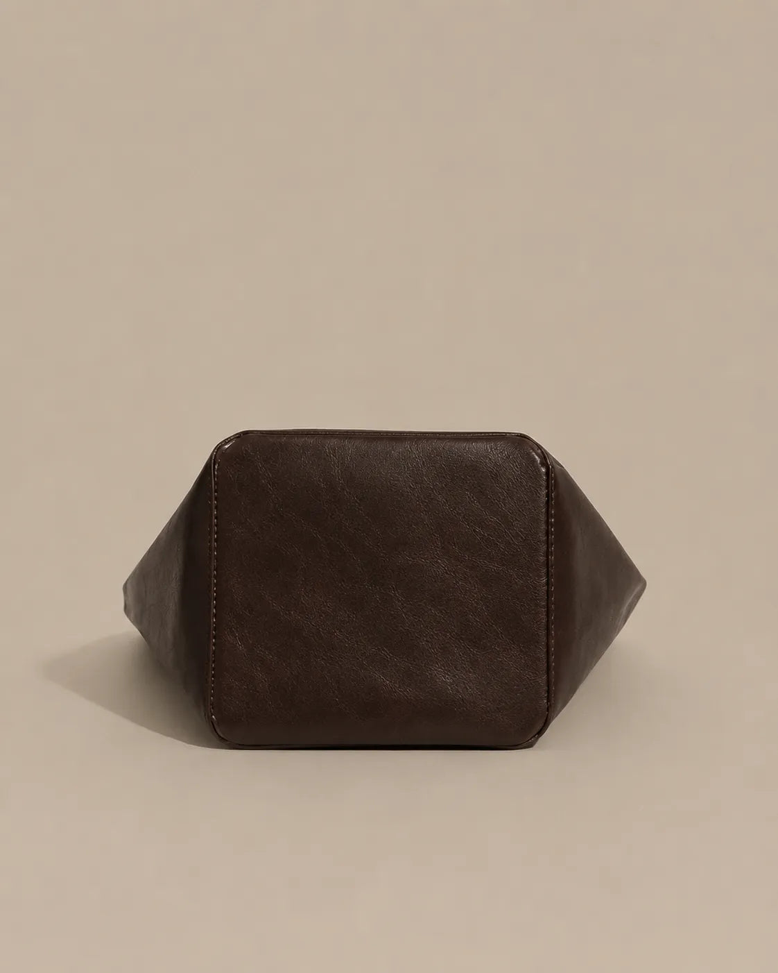 Bottom view of the Margot Tote in dark chocolate leather, showcasing its structured base and durable craftsmanship.