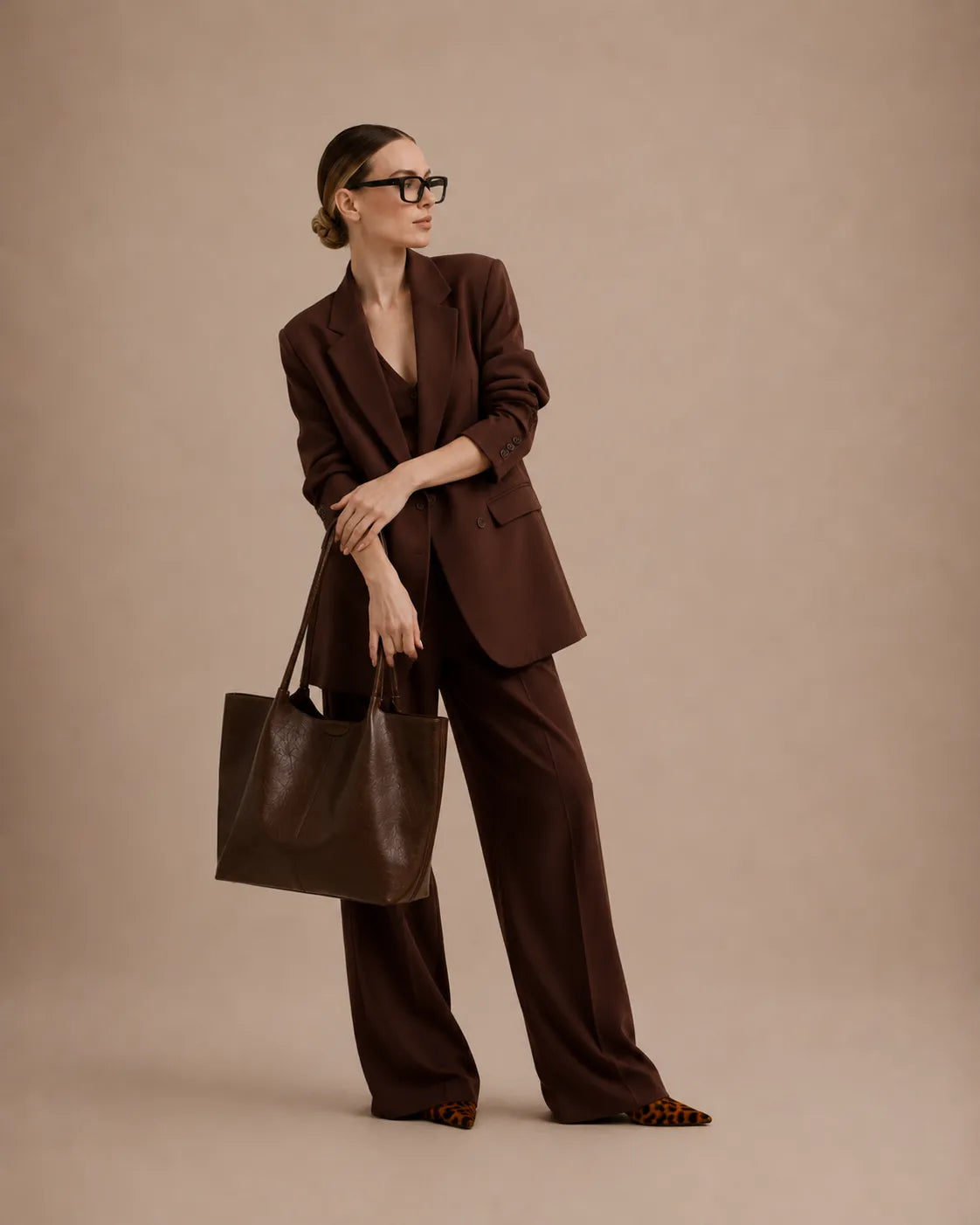 Editorial styling image of the Valentina Tote in dark chocolate leather highlighting its soft structure, spacious design and refined everyday appeal.
