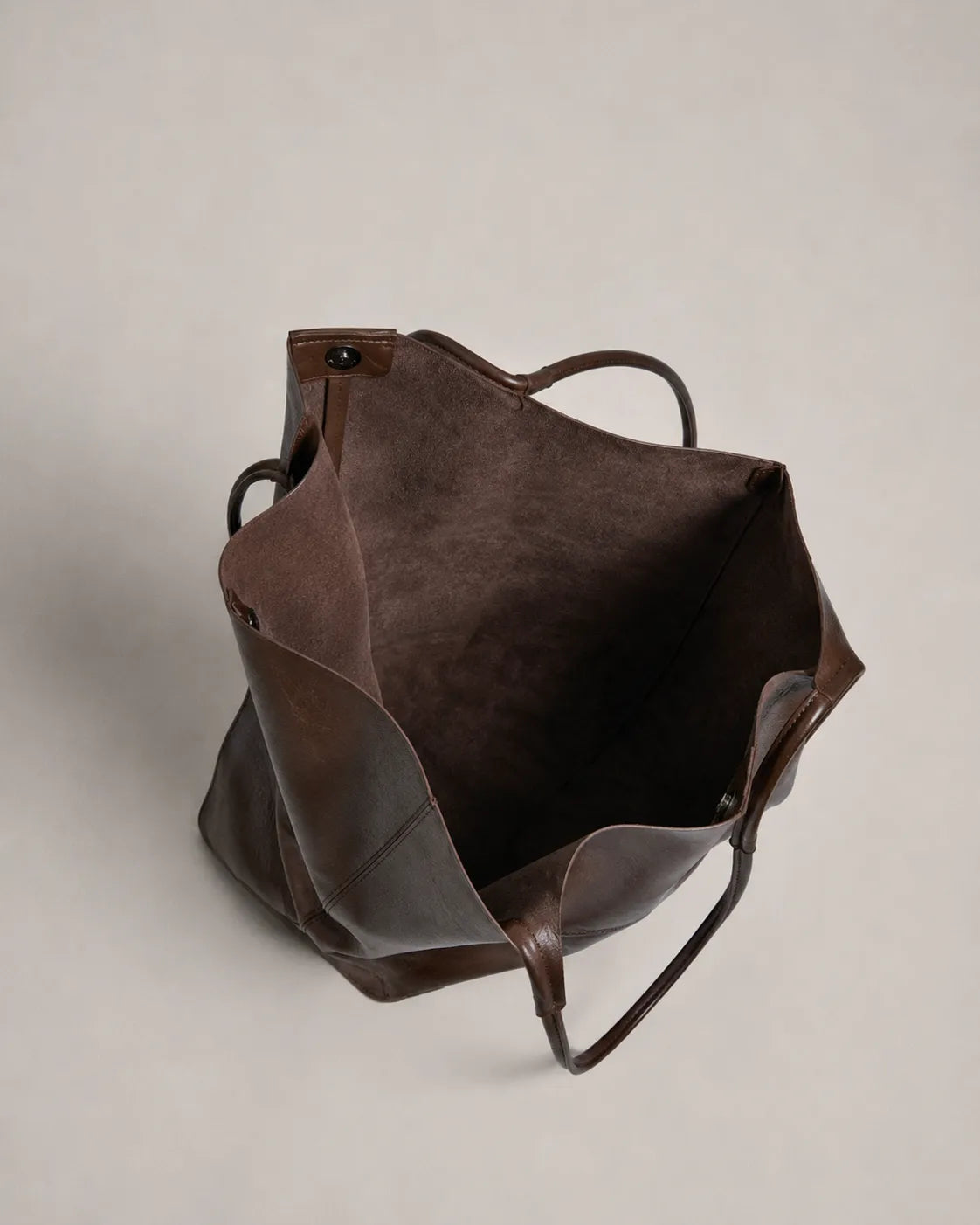 Interior view of the Valentina Tote in dark chocolate leather highlighting its spacious compartment and everyday functionality.