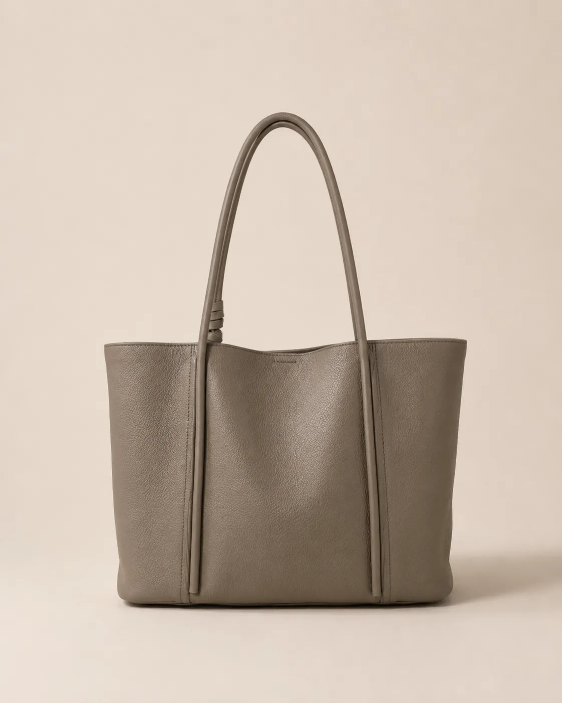 Back view of the Vivienne large Togo leather tote bag in elephant grey featuring a clean minimalist silhouette