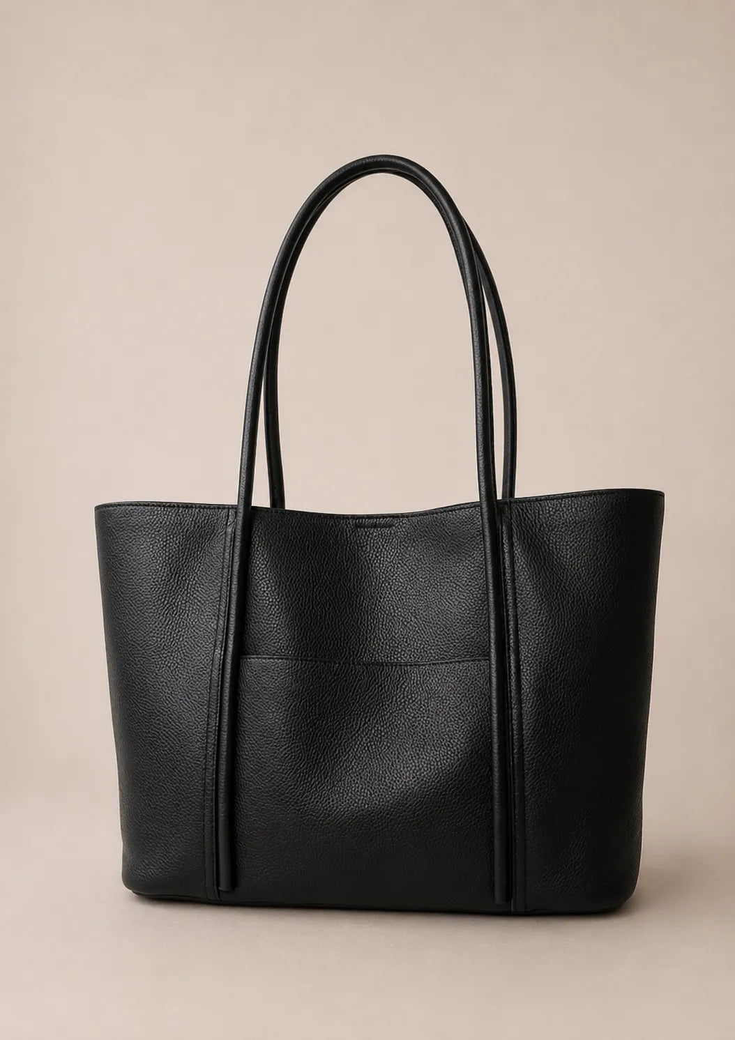 Front view of the Vivienne large Togo leather tote bag in black featuring a spacious silhouette, double shoulder straps and exterior slip pocket.