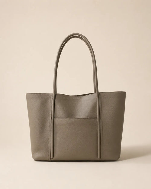 Front view of the Vivienne large Togo leather tote bag in elephant grey with exterior slip pocket and double shoulder straps