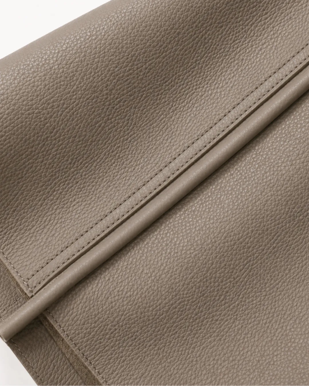Close-up detail of the Vivienne large tote bag in elephant grey showcasing the premium first-layer Togo cowhide leather grain and refined craftsmanship.