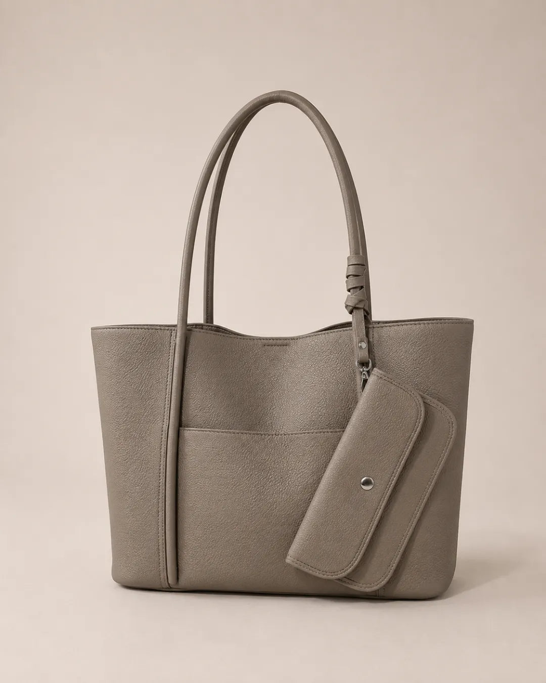 Front view of the Vivienne large Togo leather tote bag in elephant grey featuring a spacious silhouette, exterior slip pocket and matching detachable coin pouch included with the bag.