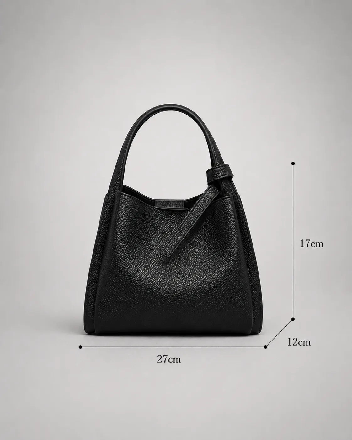 Dimensions view of the Amelia Leather Tote Bag in Black genuine leather measuring 27cm wide, 17cm high and 12cm deep.