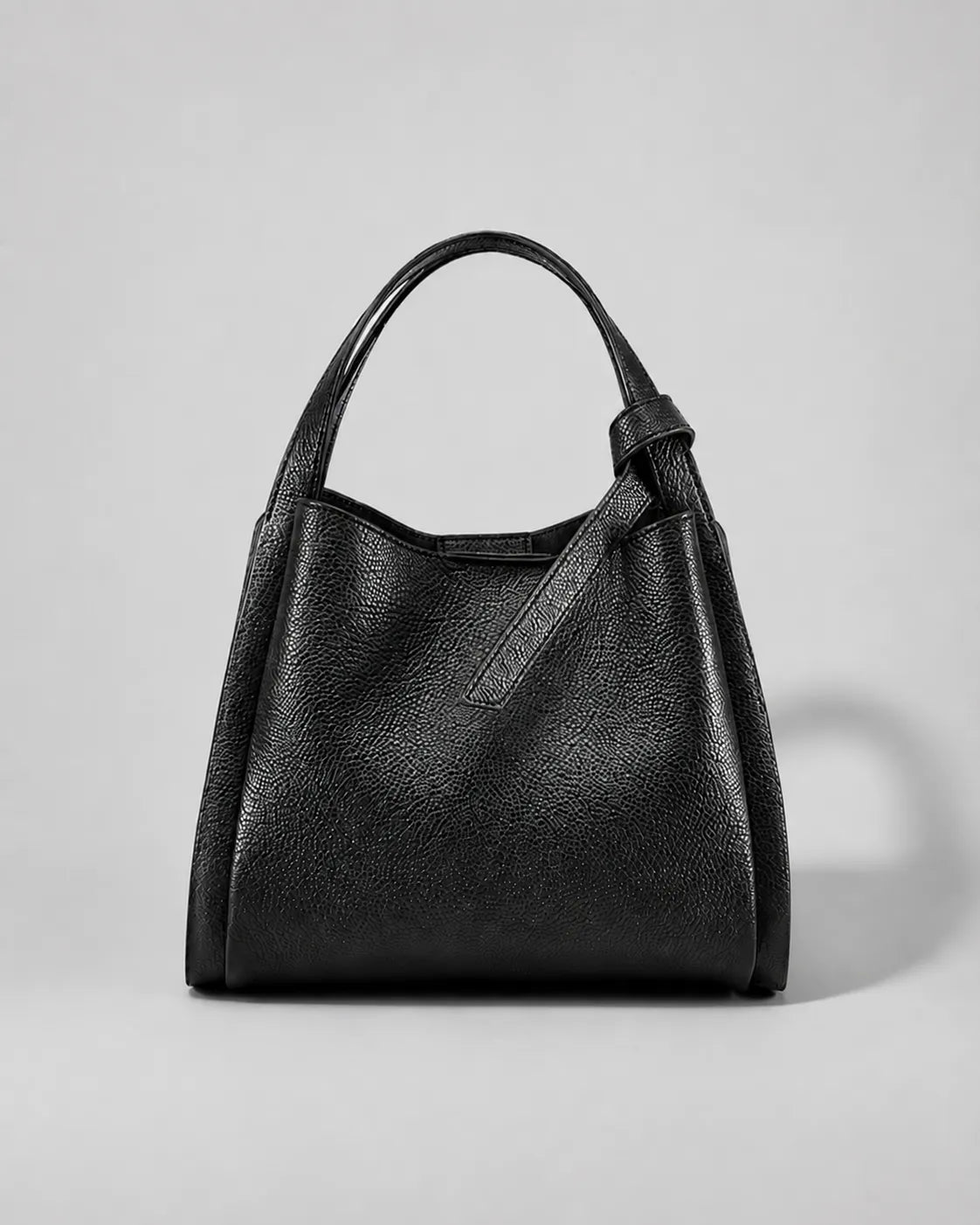 Front view of the Amelia Leather Tote Bag in Black genuine leather featuring a timeless minimalist silhouette for everyday use.