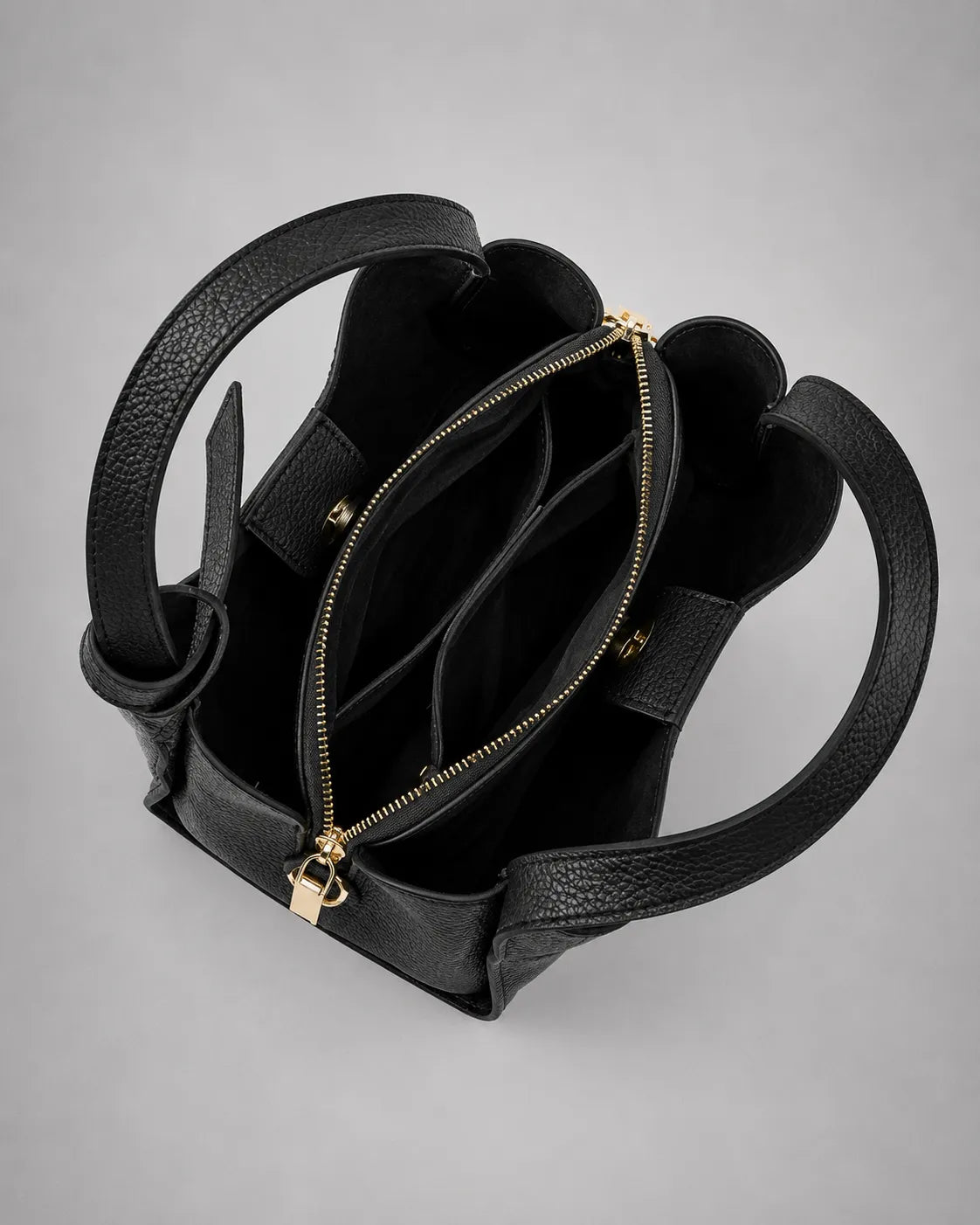 Open interior view of the Amelia Leather Tote Bag in Black genuine leather highlighting organised storage compartments and premium craftsmanship.