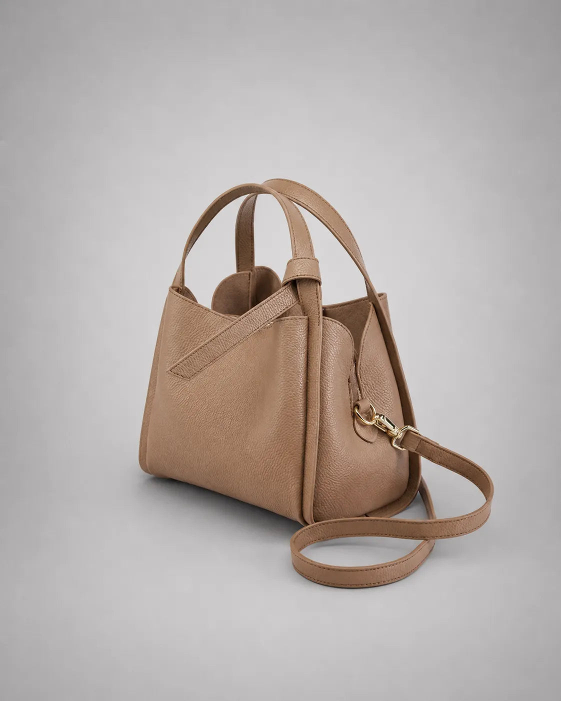 Angled front view of the Amelia Leather Tote Bag in Khaki genuine leather showcasing its structured shape and versatile carrying options.