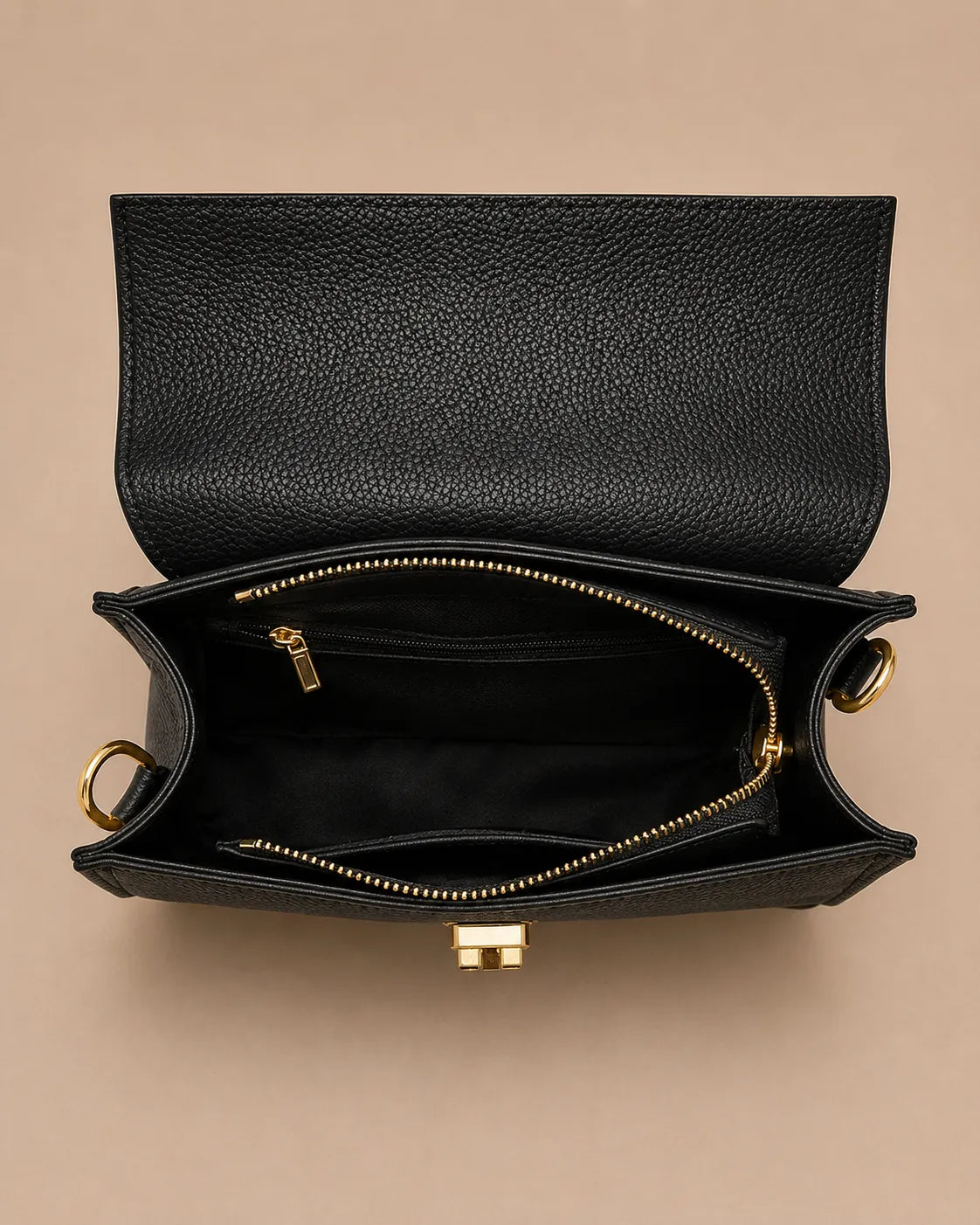 Interior view of the Beatrice genuine leather top handle bag in black featuring a spacious main compartment, secure zippered center pocket, premium lining and organized storage for everyday essentials. The Essentials Collection by Malena London.