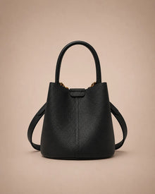 Charlotte genuine leather bucket bag in black crafted from premium leather with a structured bucket silhouette and versatile carrying options.
