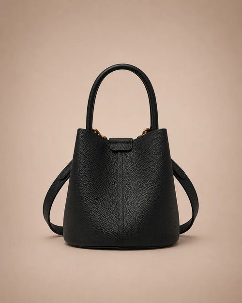 Charlotte genuine leather bucket bag in black crafted from premium leather with a structured bucket silhouette and versatile carrying options.