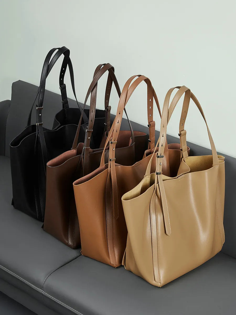 The Rosalind oversized genuine leather tote bag shown in black, coffee, brown and apricot side by side.