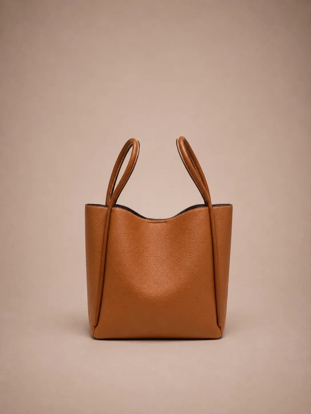 Back view of the Delphine Leather Shoulder Bag in Cookie genuine leather showcasing its clean lines, structured construction, premium leather texture and elegant minimalist silhouette by Malena London.