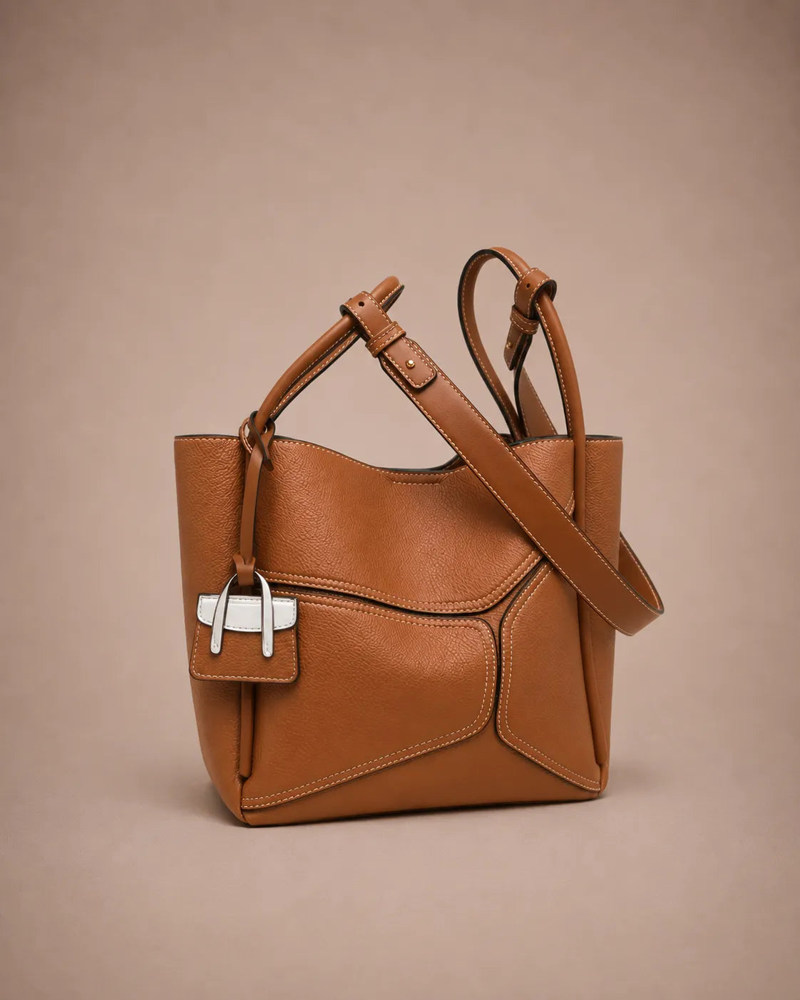 Delphine Leather Shoulder Bag in Cookie genuine leather with removable 60 cm shoulder strap, structured top handles and distinctive architectural panel detailing by Malena London.