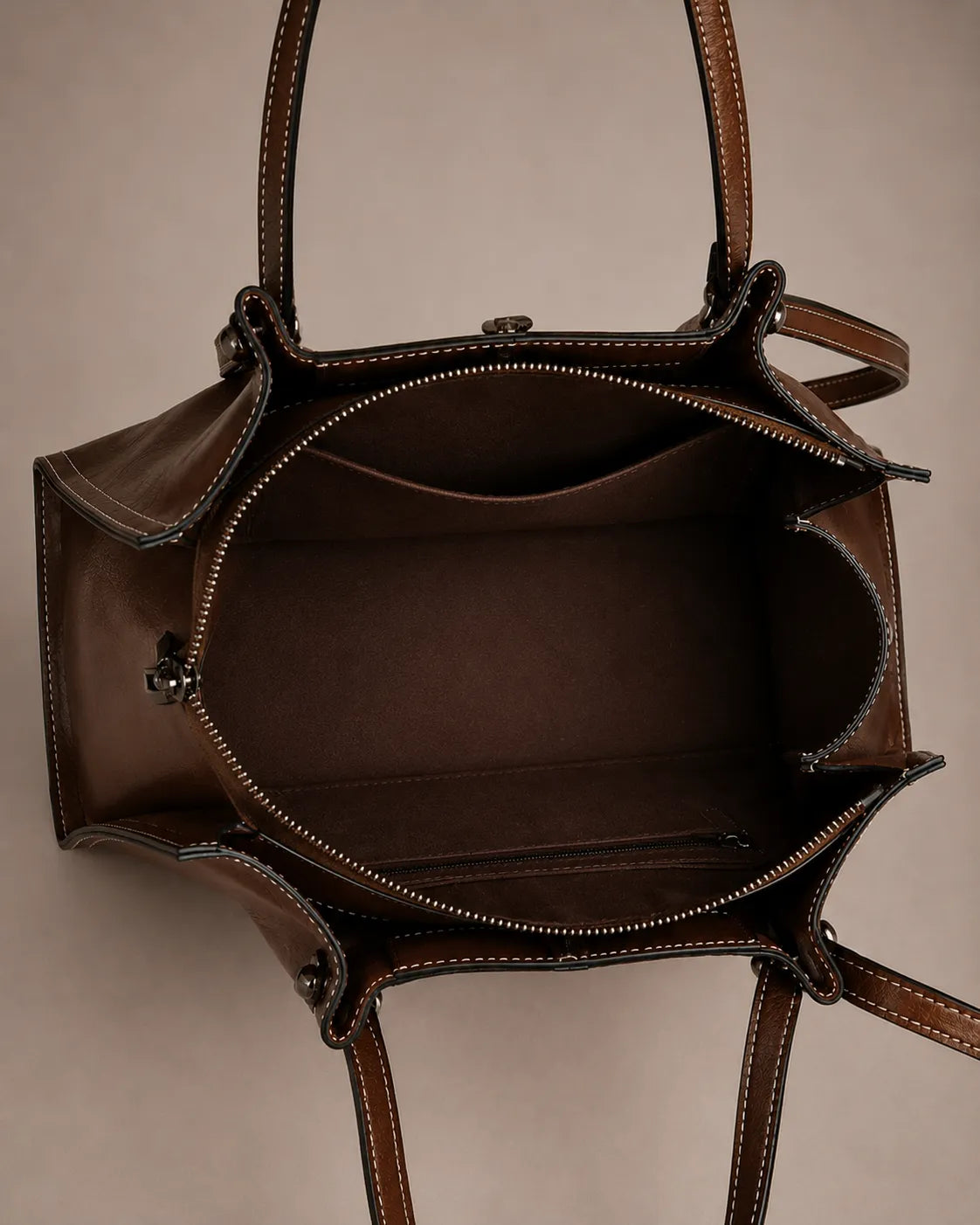 Interior view of the Edith Leather Tote Bag in Dark Chocolate genuine leather, showcasing the spacious compartment, internal pockets and practical everyday organization from The City Edit collection by Malena London.