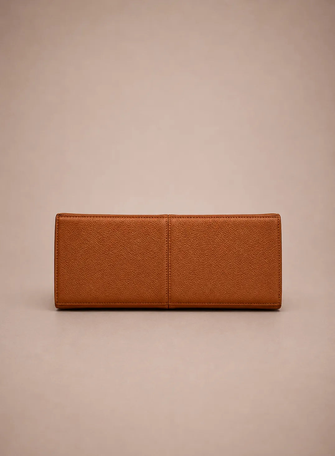 Bottom view of the Eleanor genuine leather tote bag in Brown showcasing its structured base construction, reinforced panels and premium craftsmanship. Elegant women's leather tote bag designed for daily commuting, work and travel.