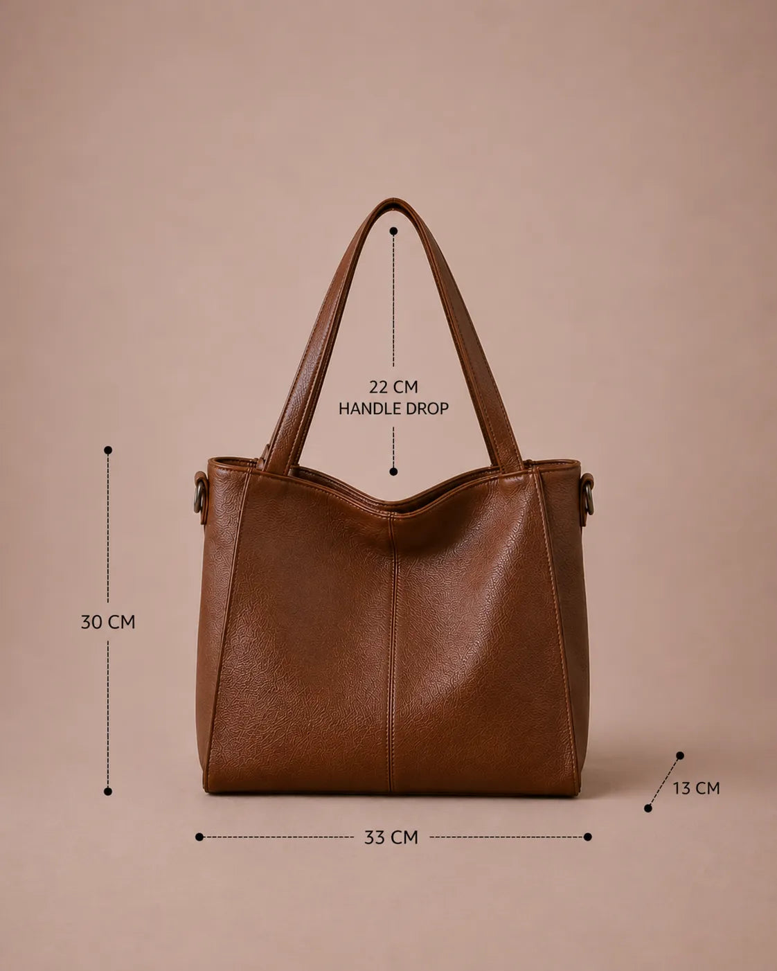 Dimensions of the Eleanor genuine leather tote bag in Brown. Width 35 cm, Depth 13 cm, Height 30 cm and Handle Drop 22 cm. Spacious women's leather tote bag designed for commuting, work, travel and daily essentials.