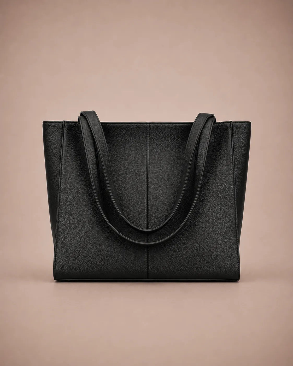 Eleanor genuine leather tote bag in Black featuring a structured vertical silhouette, long shoulder handles, spacious interior capacity and minimalist design. Premium women's leather work bag from The City Edit collection by Malena London.