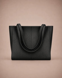 Eleanor genuine leather tote bag in Black featuring a structured vertical silhouette, long shoulder handles, spacious interior capacity and minimalist design. Premium women's leather work bag from The City Edit collection by Malena London.