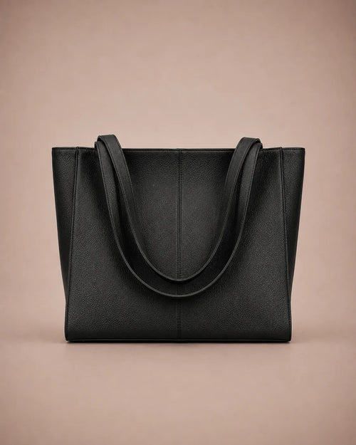 Eleanor genuine leather tote bag in Black featuring a structured vertical silhouette, long shoulder handles, spacious interior capacity and minimalist design. Premium women's leather work bag from The City Edit collection by Malena London.
