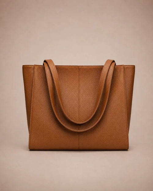 Eleanor genuine leather tote bag in Brown featuring a structured vertical silhouette, long shoulder handles, spacious interior capacity and minimalist design. Premium women's leather work bag from The City Edit collection by Malena London.