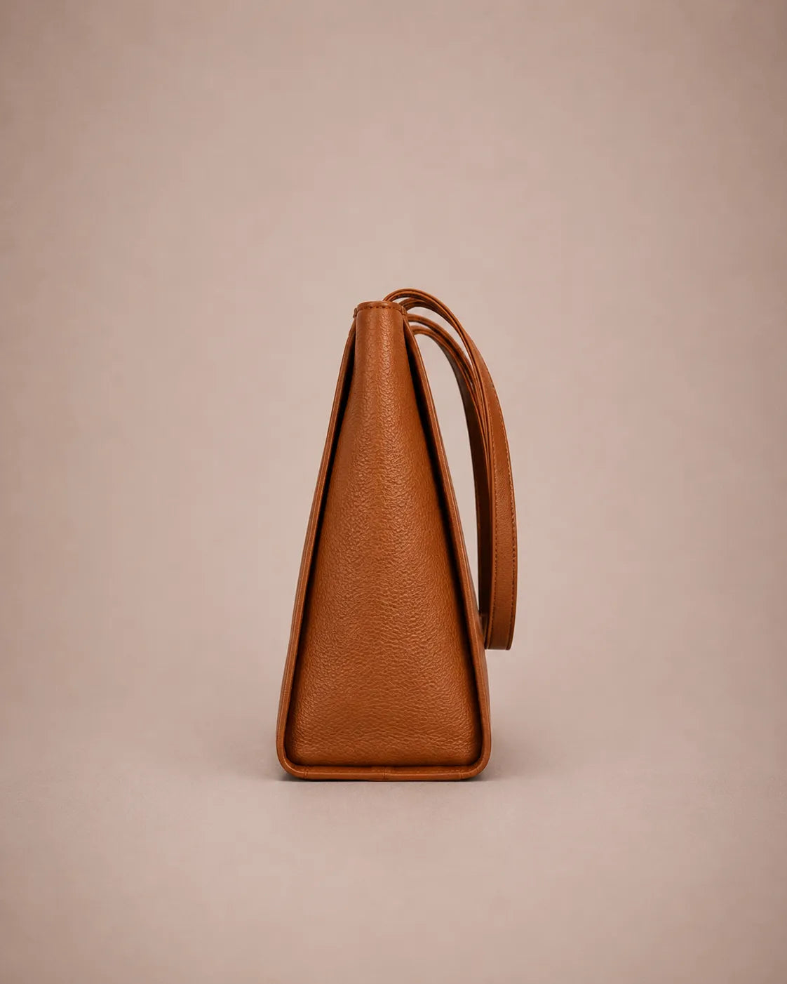 Side profile of the Eleanor genuine leather tote bag in Brown showing its structured shape, 13 cm depth and premium pebbled leather texture. Practical leather tote bag designed for commuting, office and everyday use.