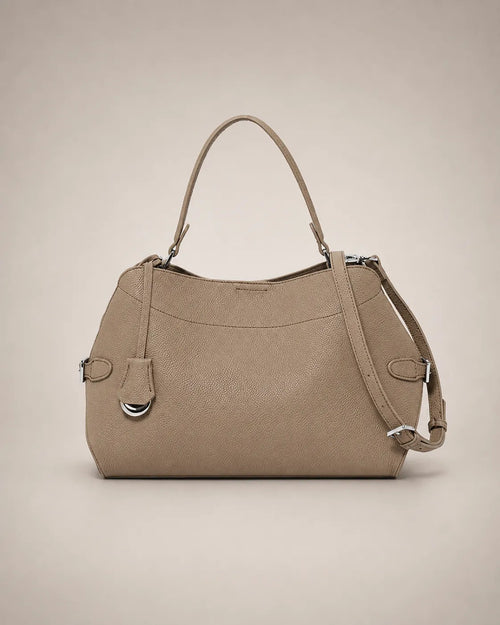Front view of the Eliza genuine leather shoulder bag in Camel featuring a softly structured silhouette, removable shoulder strap, adjustable crossbody strap, silver-tone hardware and premium pebbled leather by Malena London.