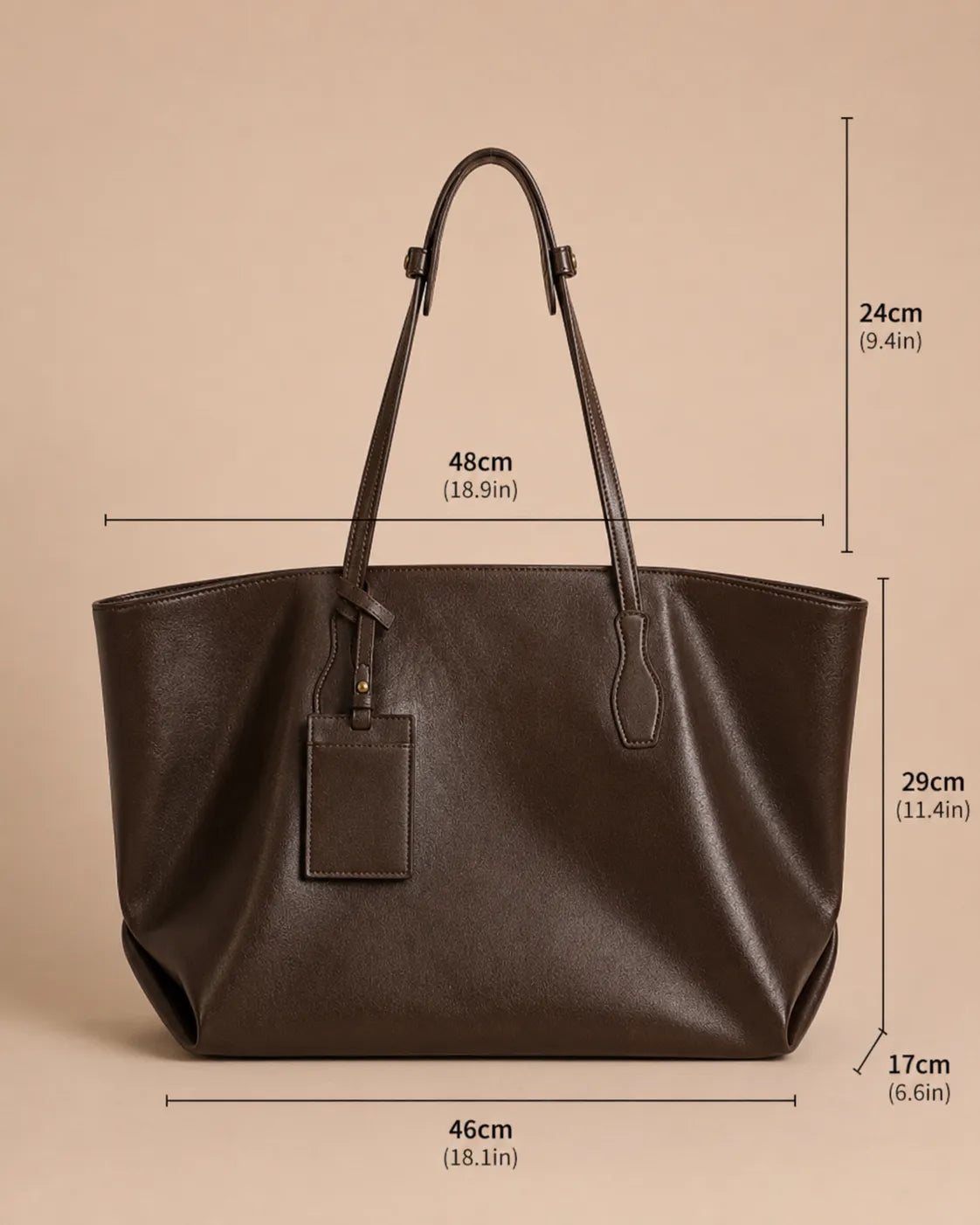 Dimensions of the Emilia Tote leather tote bag showing 46 cm width, 17 cm depth, 29 cm height and 24 cm shoulder drop.