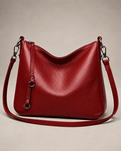 Front view of the Noémie soft genuine leather hobo shoulder bag in red showing the relaxed silhouette and double straps.