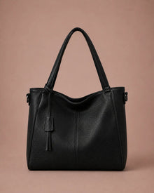 The Eleanor genuine leather tote bag in Black featuring a soft structured silhouette and spacious design for work, travel and everyday use.