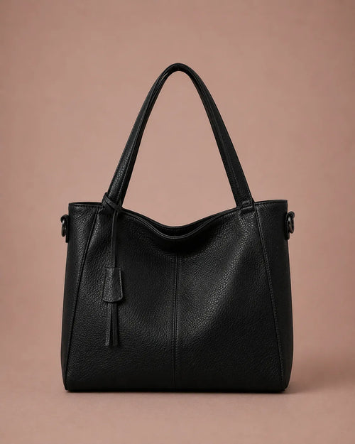 The Eleanor genuine leather tote bag in Black featuring a soft structured silhouette and spacious design for work, travel and everyday use.